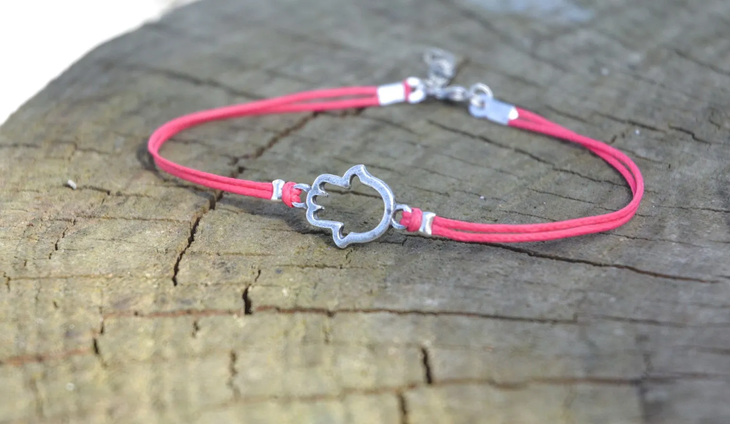 Pink dainty cord anklet with a silver Hamsa charm, hand of Fatima, evil eye protection